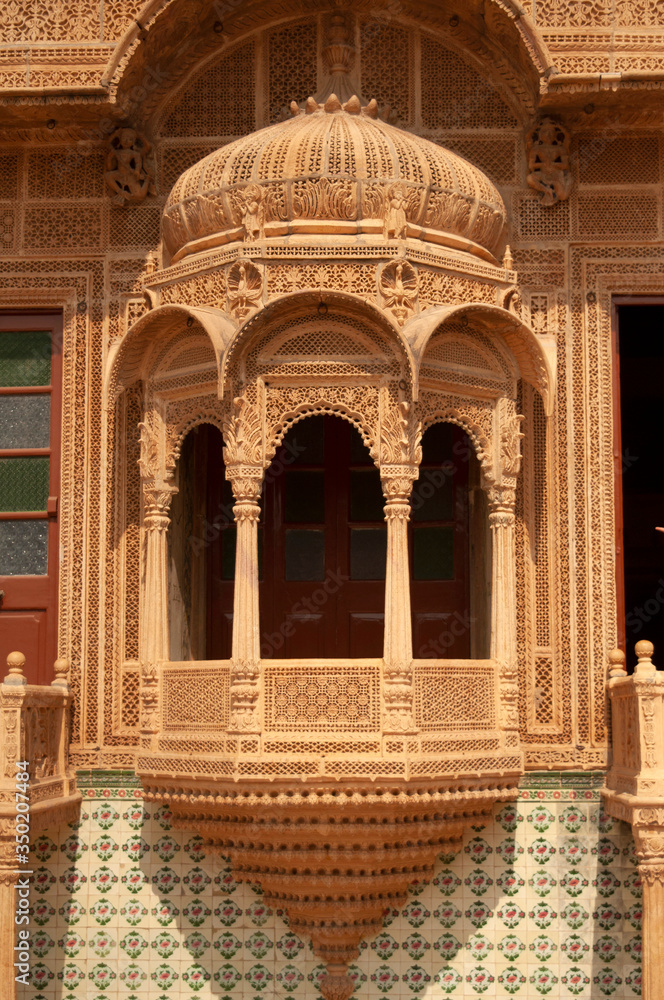 Ornate caved balcony, Mandir Palace  residence of the rulers of Jaisalmer for 2 centuries,   Jaisalmer, Rajasthan, India