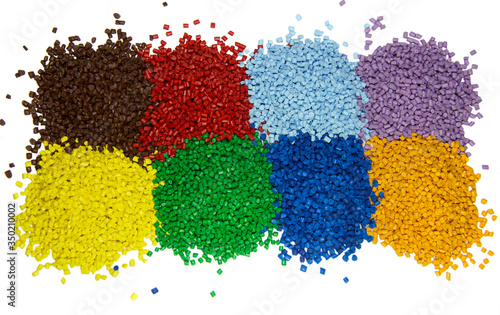Multi colored plastic polymer granules isolated on white 