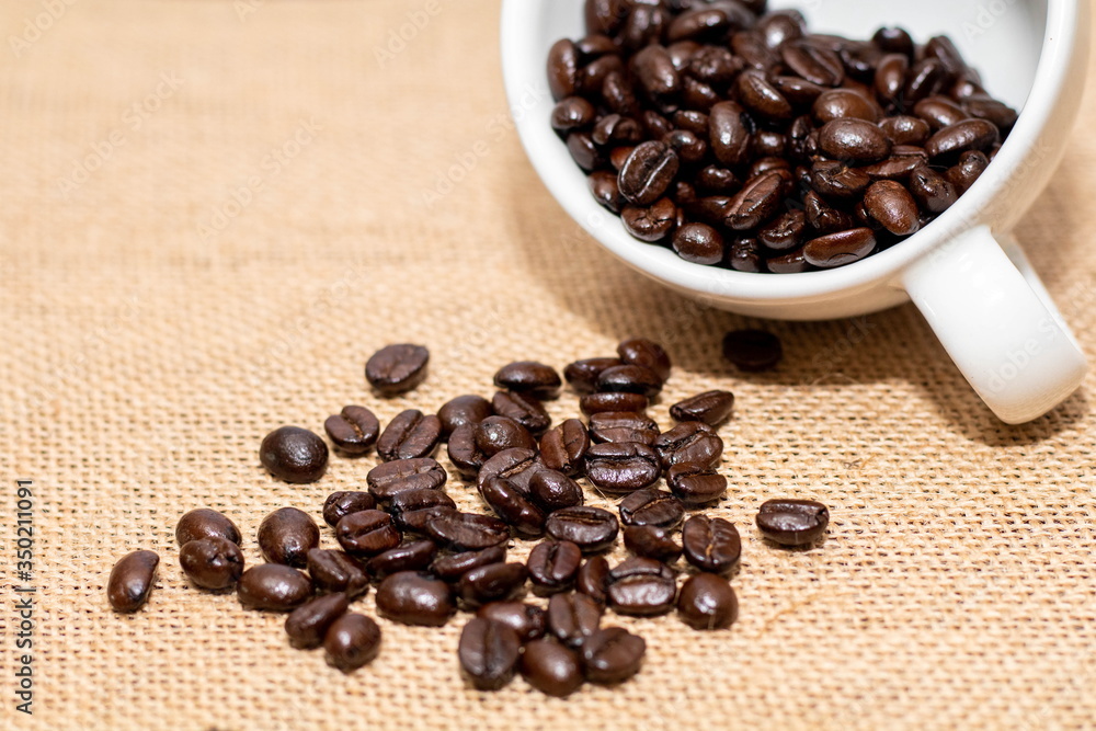 Cup of coffee with coffee beans on old background Cup of coffee with coffee beans on old background