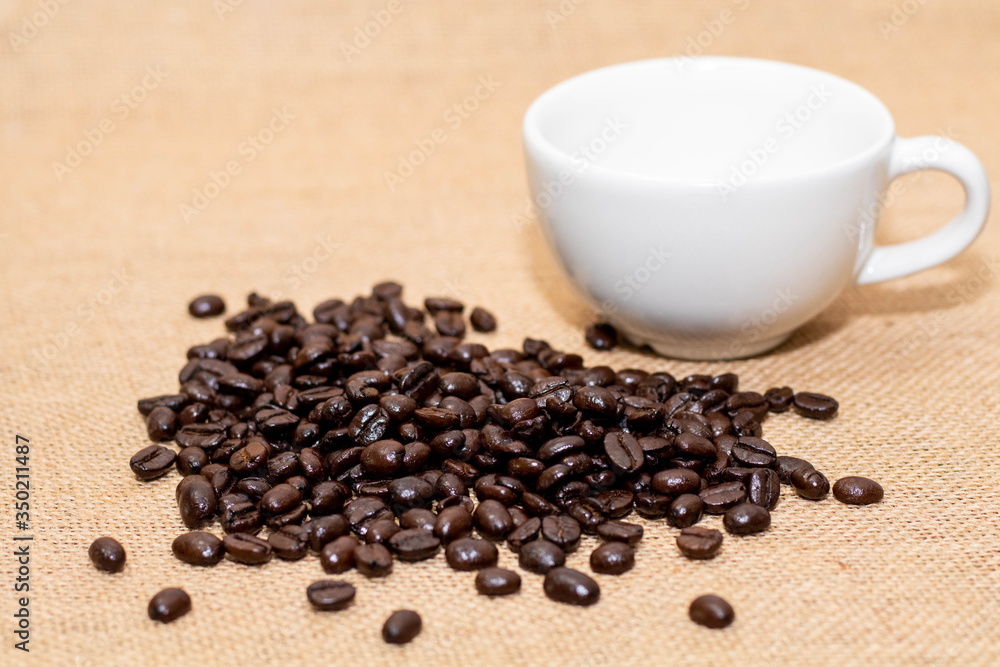 Cup of coffee with coffee beans on old background Cup of coffee with coffee beans on old background