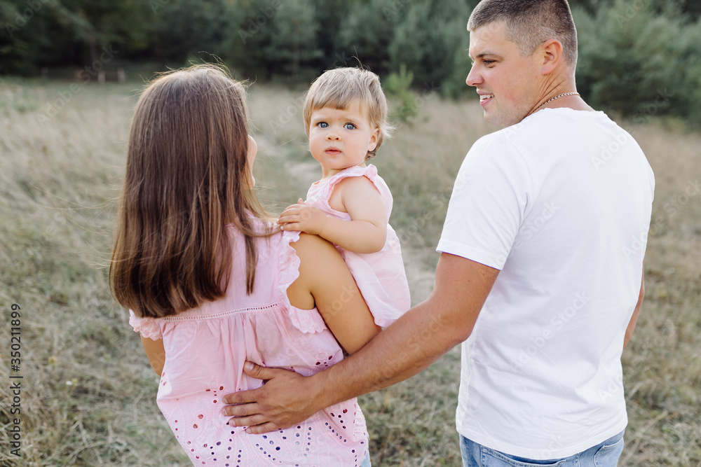 Fototapeta premium Happy family outdoors spending time together