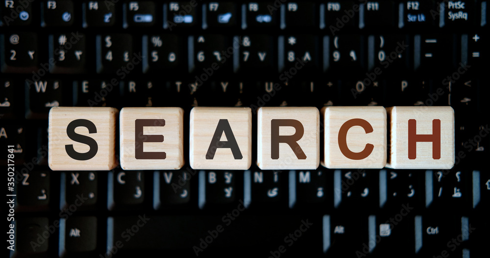 Search - concept text on wooden cubes on background black keyboard