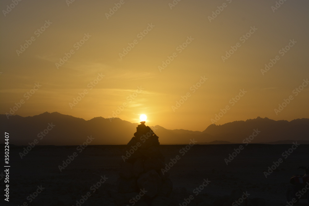 Sunset and rocks in desert