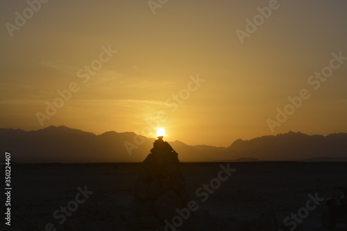 Sunset and rocks in desert