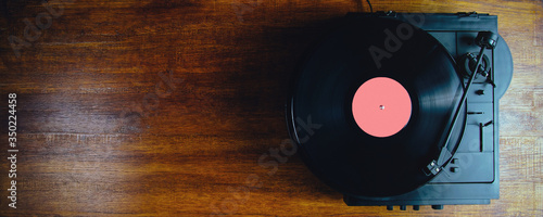 Turntable and vinyl records on a dark background
