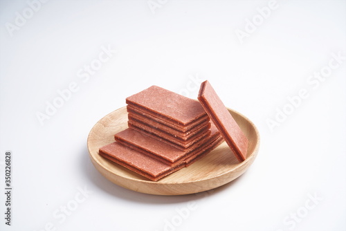 Fruit sandwich hawthorn slices in a wooden tray, he in a white background