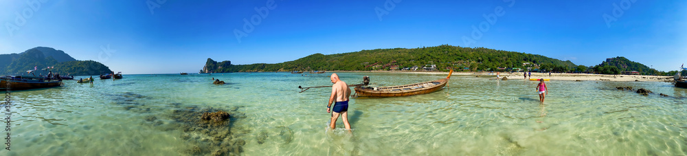 PHI PHI DON, THAILAND - DECEMBER 23, 2019: Loh Dalum Beach on a sunny afternoon. Panoramic view