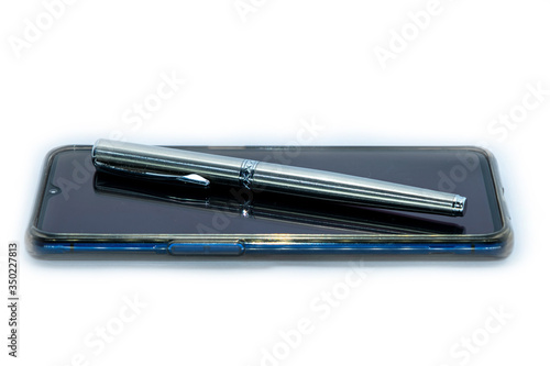 Luxury pen on a smart phone on white Background.