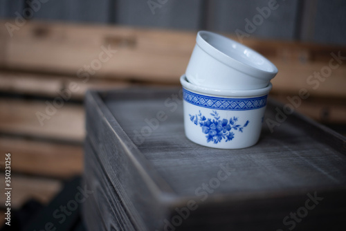 ceramic jars on wooden background 