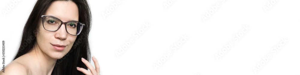 banner smiling girl doctor in glasses on a white background, brunette with natural imperfect skin and expressive brown eyes, natural, with bare shoulders. copyspace area for slogan or text message banner smiling girl doctor in glasses on a white background, brunette with natural imperfect skin and expressive brown eyes, natural, with bare shoulders. copyspace area for slogan or text message