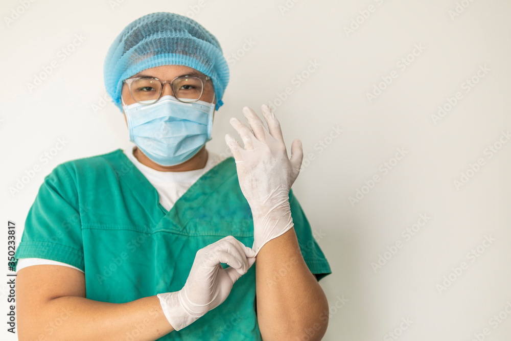 Doctor Puts on Gloves and Wearing Medical Mask. Covid-19, Corona Virus concept Doctor Puts on Gloves and Wearing Medical Mask. Covid-19, Corona Virus concept