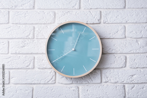 Wallpaper Mural Wooden clock in minimalistic style on a white brick wall Torontodigital.ca