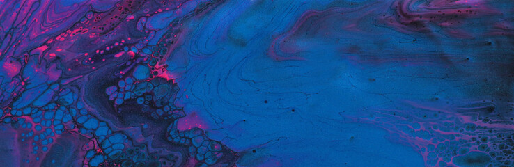 art photography of abstract marbleized effect background. Black, blue, pink and purple creative colors. Beautiful paint