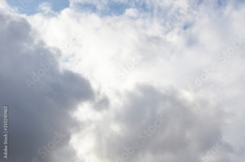 White clouds in blue sky without sun