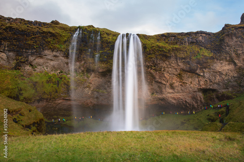 Many traveler at seljalandsfoss beautiful waterfall in Iceland