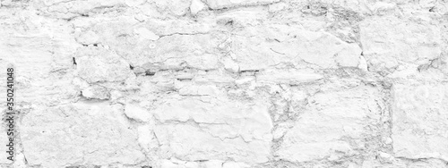 White horizontal background - texture of old stone masonry wall.