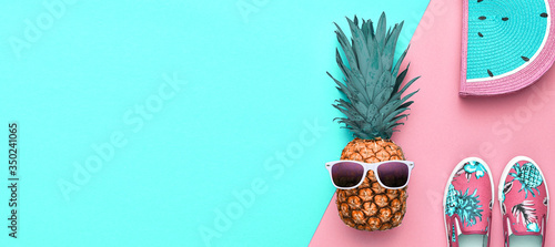 Fashion. Pineapple hipster in sunglasses, stylish sneakers, handbag. Minimal concept, summer accessories, tropical pineapple. Creative art fashionable concept, summertime, banner