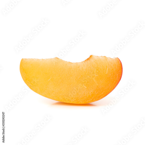 Slice of fresh apricot isolated on white background
