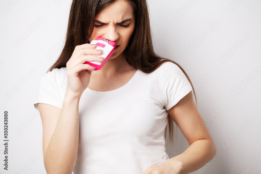 Pretty woman uses an epilator to remove hair Pretty woman uses an epilator to remove hair