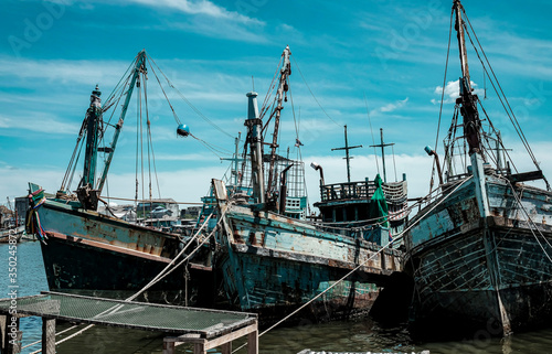 Local fishing boats dock park into the sea