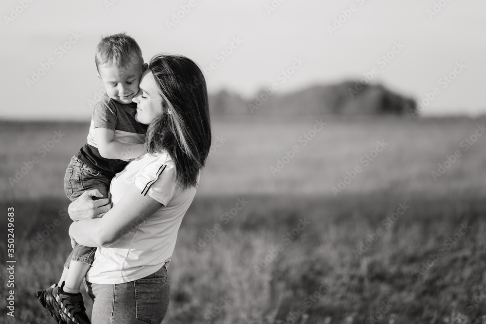 Young mother holding her little son in her hands Young mother holding her little son in her hands