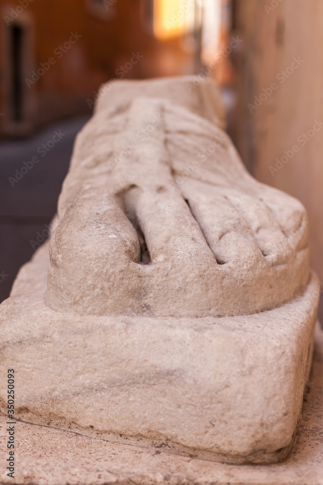 ROME, ITALY - 2014 AUGUST 21. Sculpture of a foot in the walking street ...