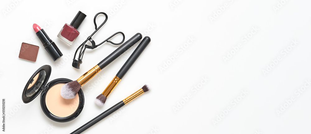 Beauty cosmetic makeup background. Fashion woman make up product, brushes, lipstick, nail polish layout. Creative concept. Cosmetology make-up accessories on white, top view. Beauty cosmetic makeup background. Fashion woman make up product, brushes, lipstick, nail polish layout. Creative concept. Cosmetology make-up accessories on white, top view.