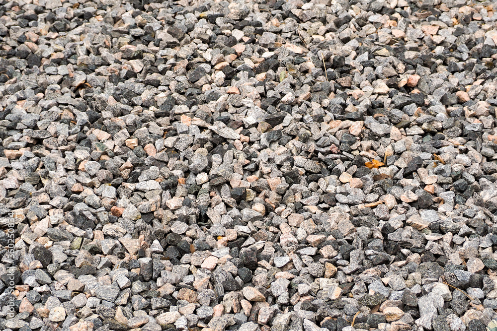 dark gravel pebbles stone texture . gray background dark gravel pebbles stone texture . gray background