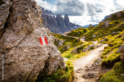 Mountain trail marking Gruppo Sella massif, South Tyrol Italy alps.