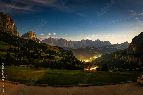 Night sky Passo Gardena mountains valley view, Italy.
