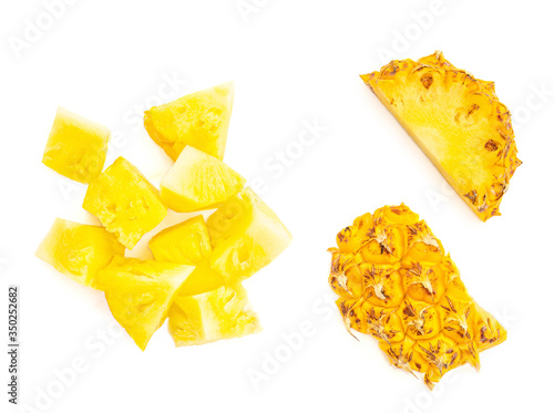 Pineapple pieces and chunks isolated on white background. Cut pineapple slice Top view. Flat lay