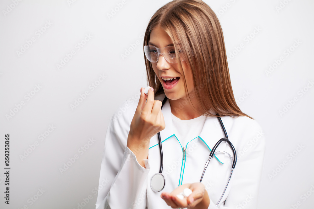 Doctor holds in his hands the prescribed pills for patient Doctor holds in his hands the prescribed pills for patient