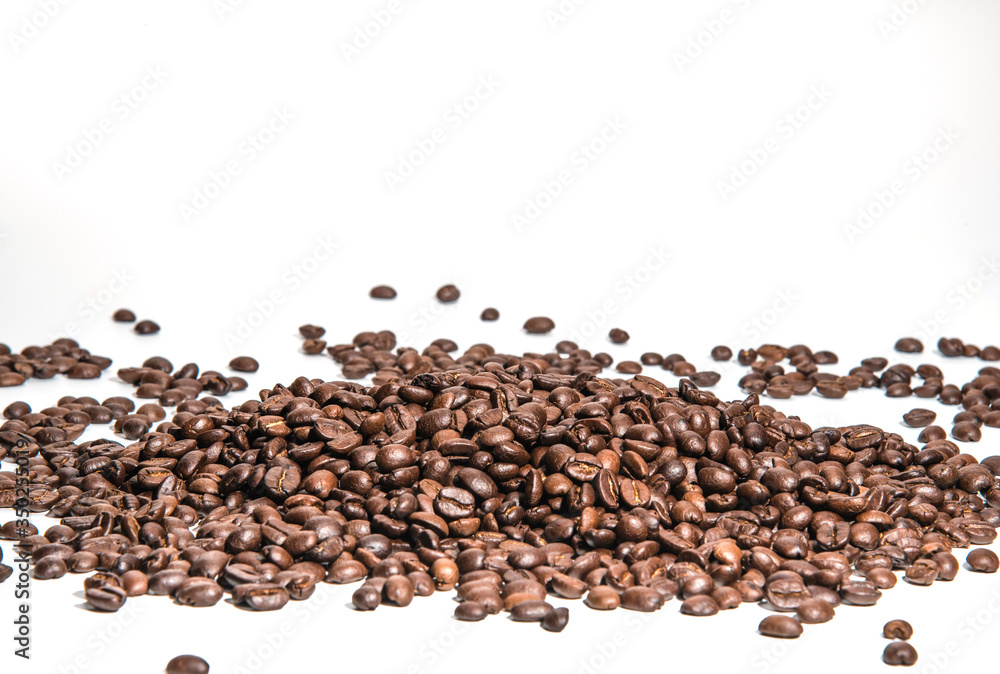 coffee beans roasted on a white background with copy space for your text coffee beans roasted on a white background with copy space for your text