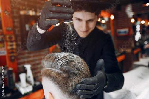 Man with a beard. Hairdresser with a client.