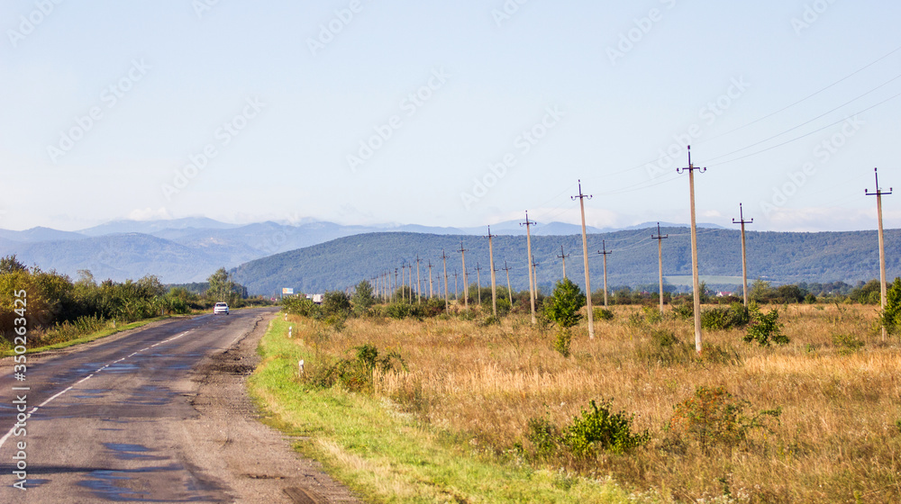 country road with car in Carpatian mountains