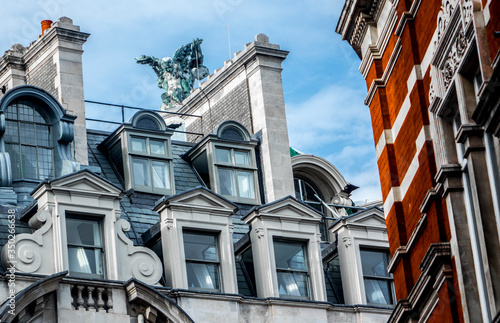 London's classy building.
Colorful close up picture of the facade of  a classy building in London, UK. You may see the statue of an angel.