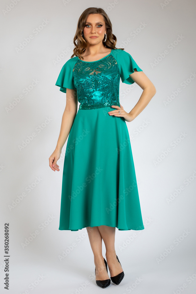 beautiful girl posing in green dress beautiful girl posing in green dress