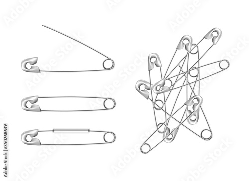 set of silver stainless steel safety  pins, accessory for sewing in different angles, sewing tool for fasten pieces of clothing together.
