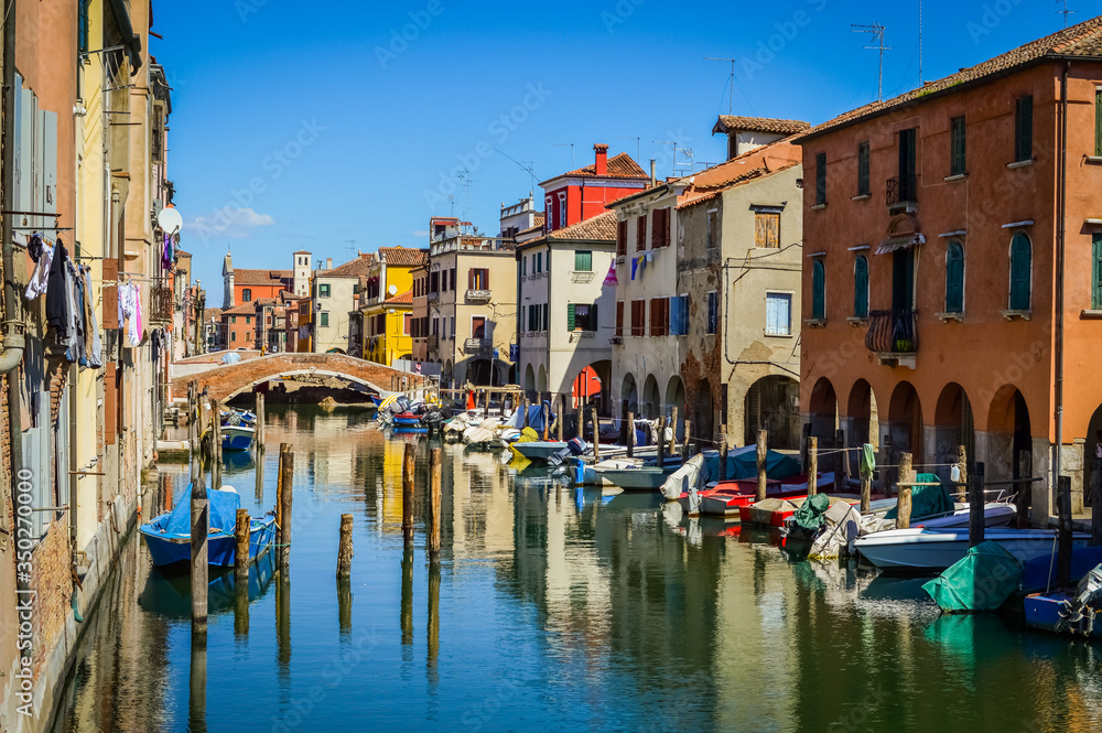 Chioggia, town in venetian lagoon, water canal and boats. Veneto, Italy, Europe.