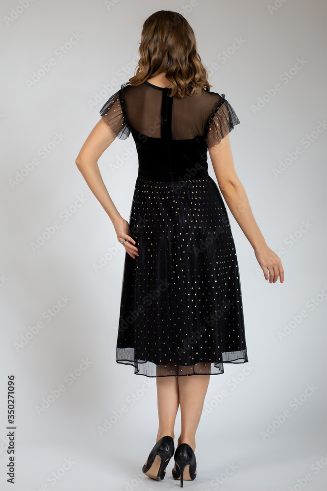 Fototapeta premium beautiful girl posing in black dress