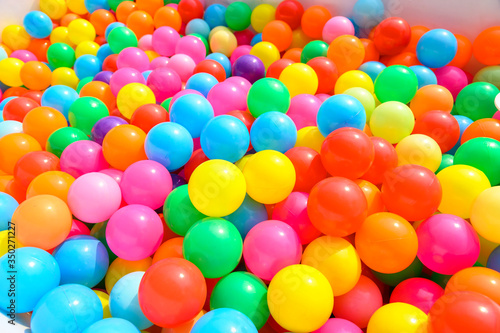 Small colorful plastic balls in playground yard