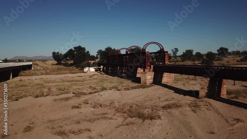 4K aerial drone video view of historical railway bridge on main B6 road from Windhoek to Gobabis near settlement Seeis in central highland Khomas Hochland of Namibia, southern Africa photo