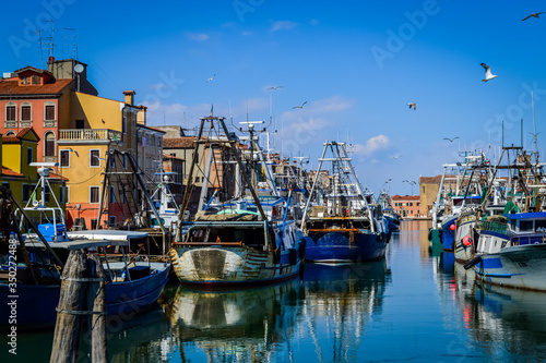 Big fishing boats moored in the port on the Adriatic sea at Chioggia, near Venice in Italy.