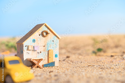 Real estate, lifestyle concept,Miniature house and car on blue sky background