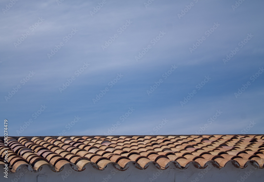Roof with blue sky with classic terracotta tiles. Roof with blue sky with classic terracotta tiles.