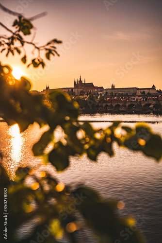 Sunset over Prague castle and Vltava river