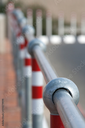 close up of a row of red and white metal pipes