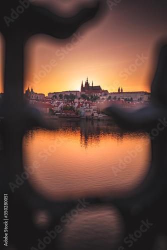 Sunset over Prague castle and Vltava river