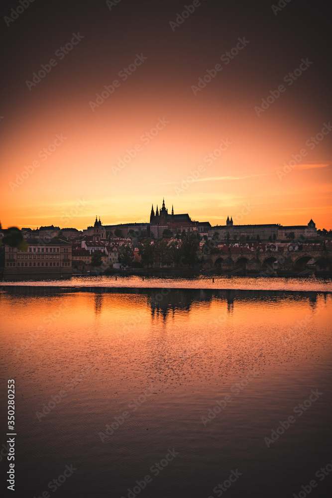 Sunset over Prague castle and Vltava river
