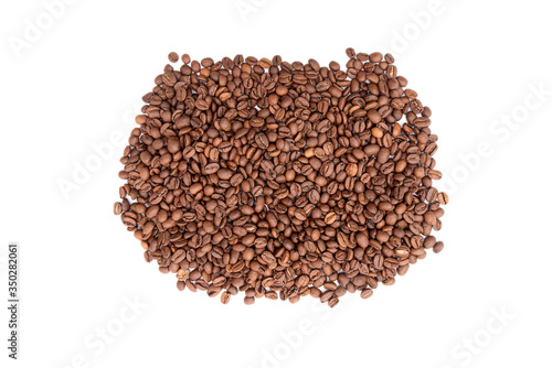 Heap of roasted coffee beans isolated on white background. Top view. 